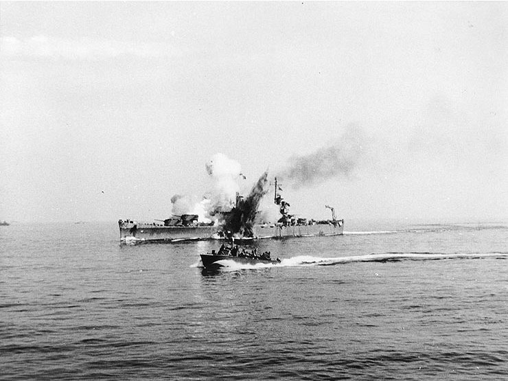 USS Savannah (CL-42) is hit by a German radio-controlled glide bomb, while supporting Allied forces ashore during the Salerno operation, September 11, 1943.