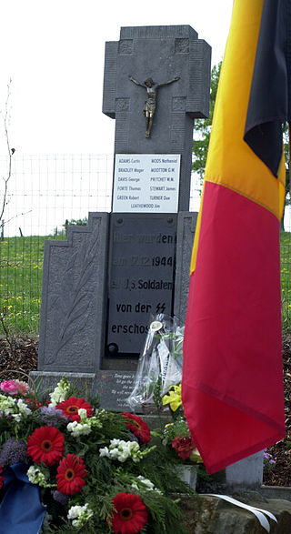 Flowers adorn one of three monuments at the Wereth 11 Memorial, dedicated to a group of black soldiers killed by the German SS during the early stages of the Battle of the Bulge.