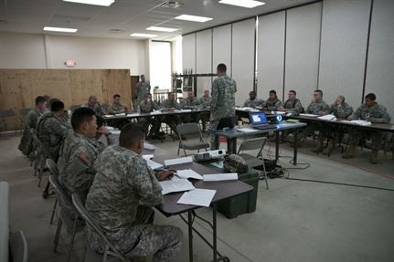U.S. Army Reserve lieutenants attend a class on how to determine the military load classification of a bridge and surrounding area during a combat support training exercise.