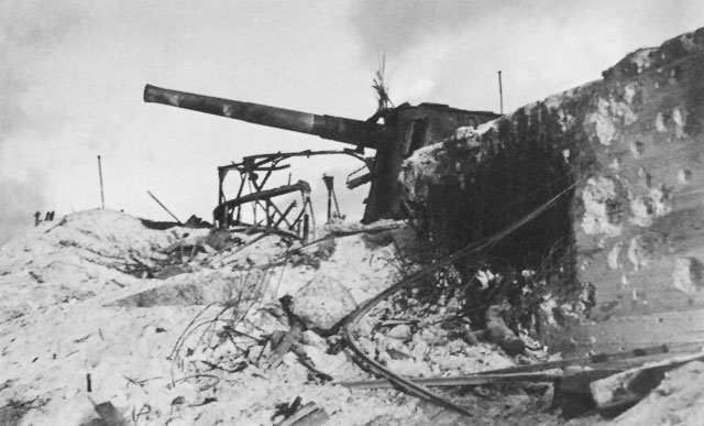 Destruction of one of the four Japanese eight-inch Vickers guns on Betio was caused by naval gunfire and air strikes.