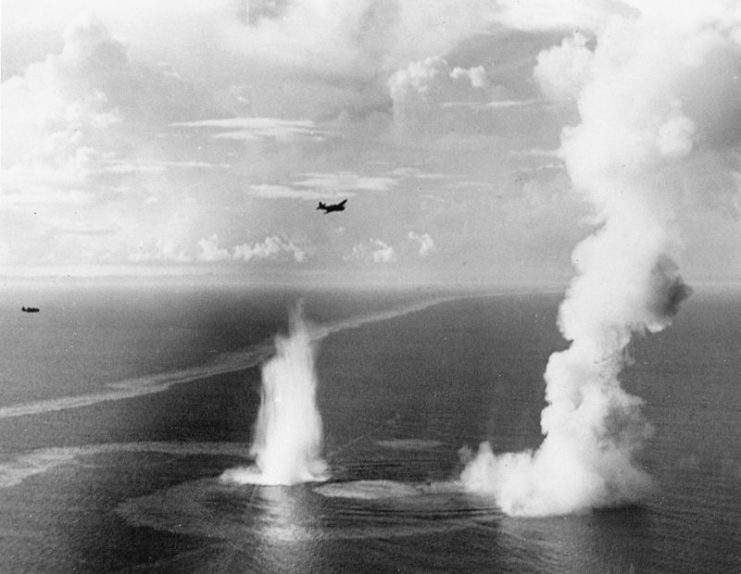 U.S. Navy Grumman TBF-1 Avenger aircraft of Torpedo Squadron VT-5 from the aircraft carrier USS Yorktown (CV-10) fly over the site where squadron aircraft scored four direct hits on the Japanese destroyer Wakatake, sinking her in fifteen seconds 110 km north of Palau.