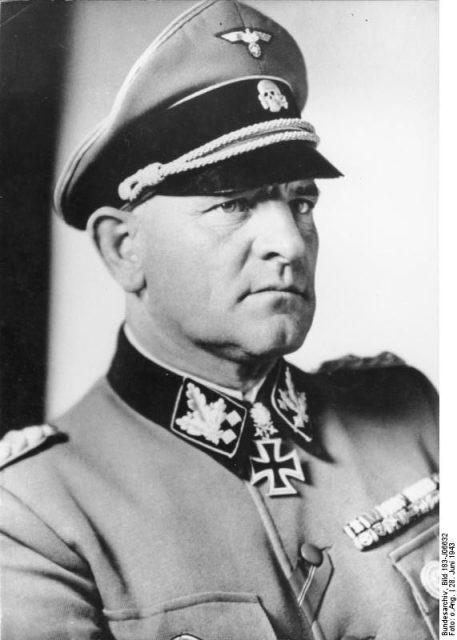 Uniform of SS-Obergruppenführer und General der Waffen SS with a Knights Cross. (This general is Josef “Sepp”). By Bundesarchiv – CC BY-SA 3.0 de