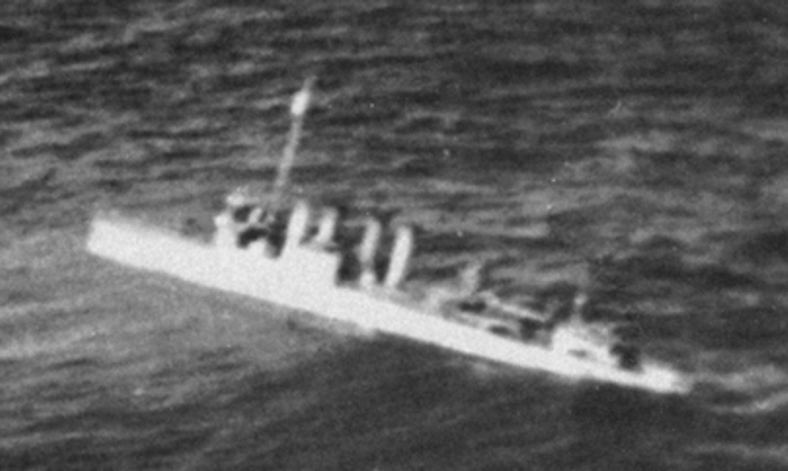 A U.S. Navy Clemson-class destroyer sinking during the Japanese Dutch East Indies Campaign, probably USS Pope (DD-225).