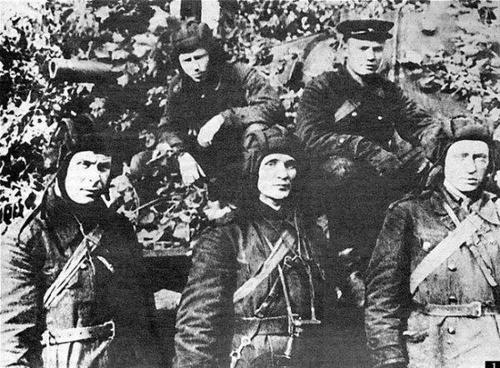 Zinoviy Kolobanov (in the center) and his Tank Crew. 1941.Zinoviy G. Kolobanov (Зиновий Г. Колобанов) (died 1995) was a tank commander and veteran of the Great Patriotic War. He commanded a KV-1 tank and is frequently considered the second top scoring tanker ace of the Soviet Union.