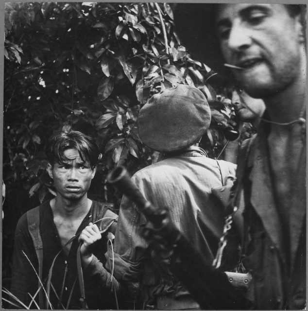 French Foreign Legion patrol question a suspected member of the Việt Minh.