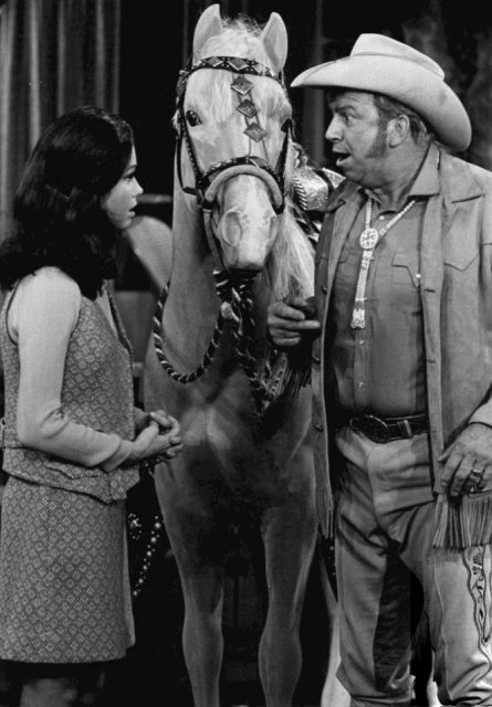 Mary Tyler Moore as Mary Richards and Slim Pickens as “Wild Jack” Monroe, owner of WJM-TV, from the television program The Mary Tyler Moore Show.