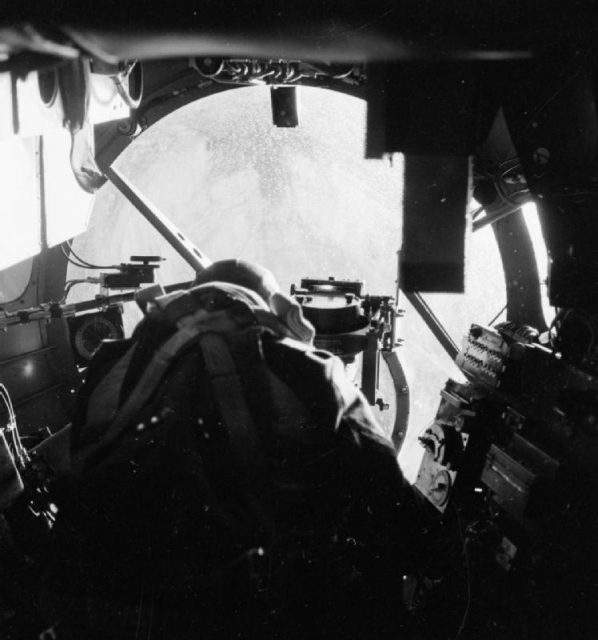 The bomb aimer on a Lancaster B Mark I at his position in the nose