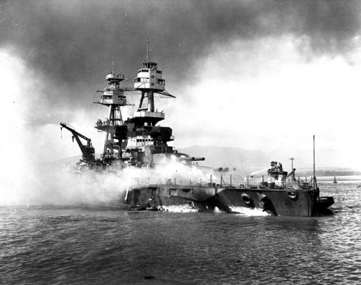 USS Nevada beached and burning as a result of damage sustained during the attack on Pearl Harbor