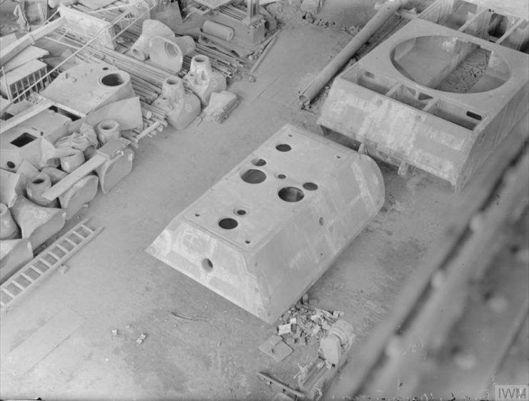 Maus turret and hull abandoned in factory, 1945