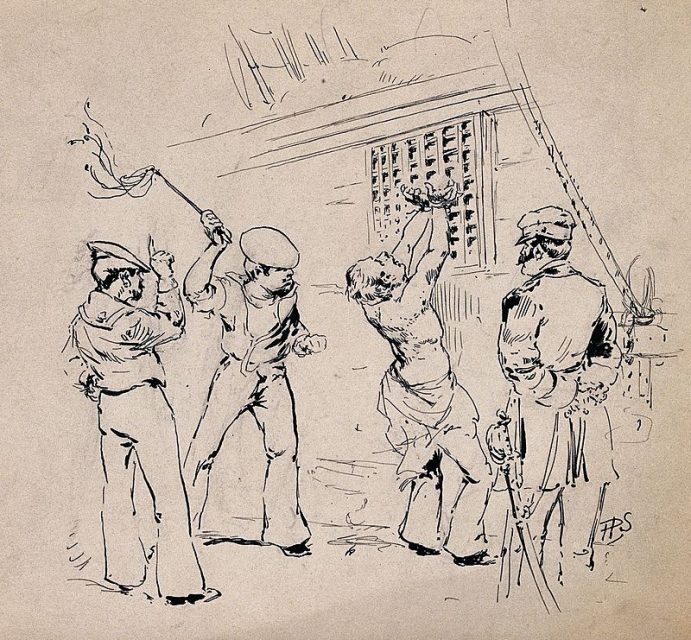 A sailor is stripped to the waist and tied to a grid by his wrists while being flogged with a cat-o’-nine-tails with the captain looking on.