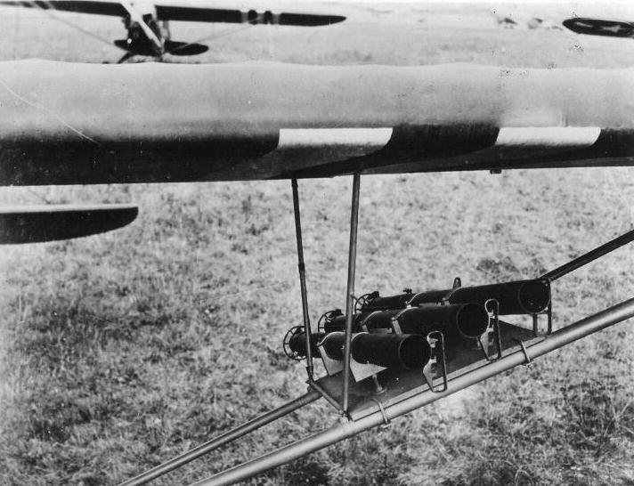 Three bazooka tubes fitted on the wing struts of an USAAF L-4 Grasshopper artillery observation aircraft, France, 24 Oct 1944