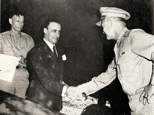 Castellano (in civilian attire) shakes hands with Dwight Eisenhower after the signing of the Armistice between Italy and Allied armed forces in Cassibile on September 8, 1943
