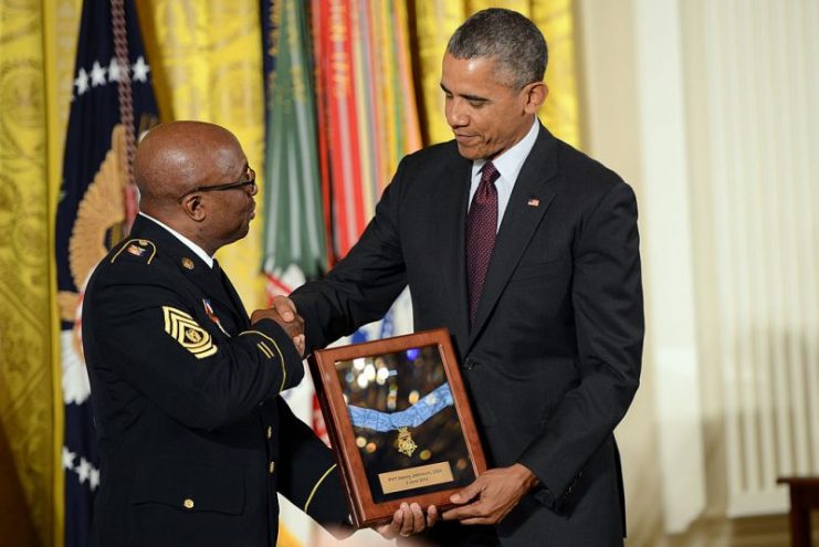 Command Sgt. Maj. Louis Wilson of the New York Army National Guard accepts the Medal of Honor on behalf of Johnson