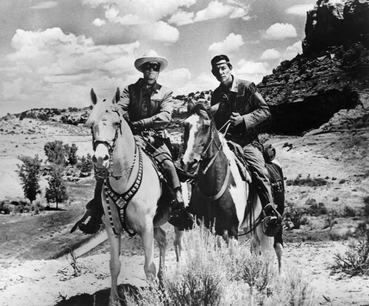 Clayton Moore as the Lone Ranger and Jay Silverheels as Tonto. Moore is riding Silver, while Silverheels is riding Scout.