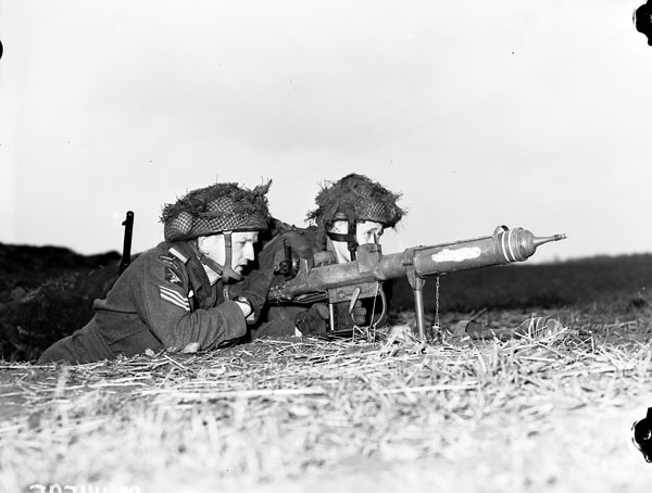 Two Airborne soldiers demonstrate the PIAT anti tank gun