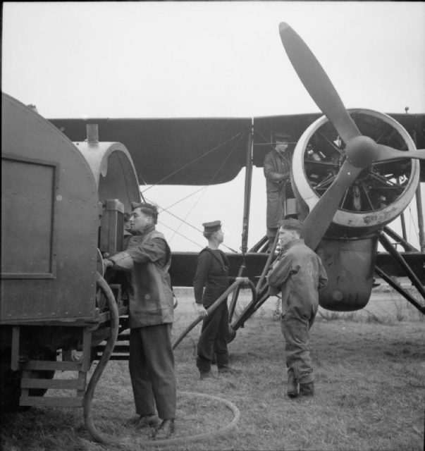 A Swordfish III of RAF 119 Squadron being refueled at Maldegem, Belgium, (1944–1945). The fairing of the aircraft’s centimetric radar can be seen below the engine
