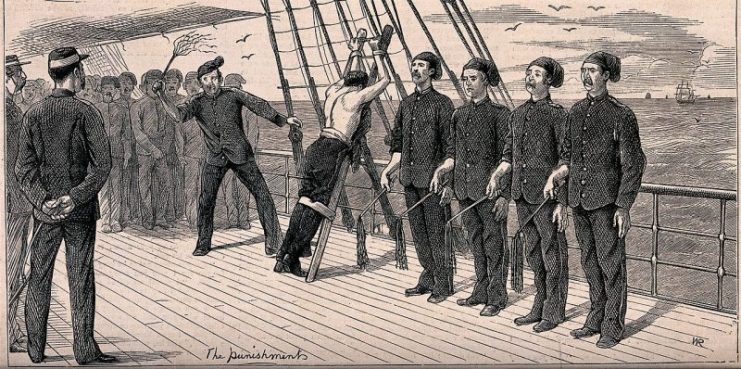 Sailor being flogged with a cat-o’-nine-tails while four sailors are waiting for their turn to flog him.Photo: Fæ CC BY 4.0
