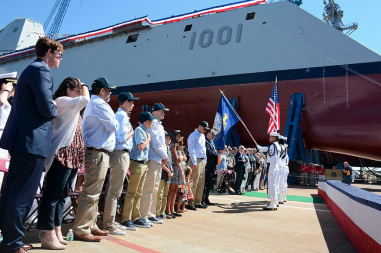 U.S. Navy crewmembers assigned to the sailing frigate USS Constitution perform a colour guard detail at the christening ceremony for guided-missile destroyer USS Michael Monsoor (DDG-1001) in the General Dynamics Bath Iron Works shipyard.