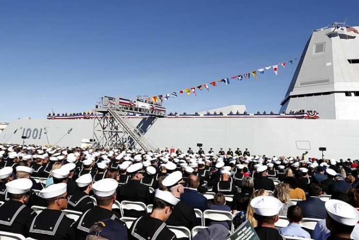 The crew of the Zumwalt-class guided-missile destroyer USS Michael Monsoor (DDG 1001) brings the ship to life during its commissioning ceremony, Jan. 26, 2019.