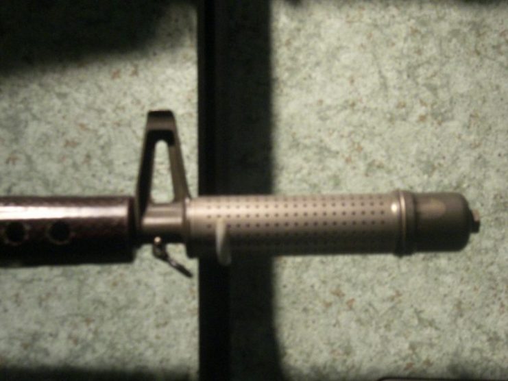 Close-up of flash Suppressor/compensator on early ‘Hollywood” model AR-10. Photo by Amendola90 CC BY SA 3.0