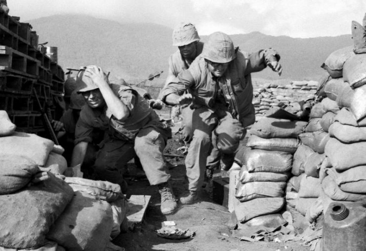 Khe Sanh, South Vietnam. March, 1968: U.S. Marines scramble for cover as another volley of Viet Cong shells lands on a besieged base.Photo: manhhai CC BY 2.0