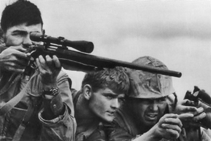 A US Marine Corps sniper team searches for targets in the Khe Sanh Valley