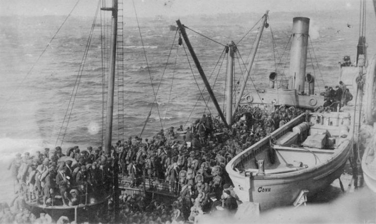 Alongside USS Connecticut (Battleship # 18) in Brest harbor, France, transferring members of the U.S. Army’s 136th Field Artillery, 37th Division, to be transported home to the US, March 11, 1919.