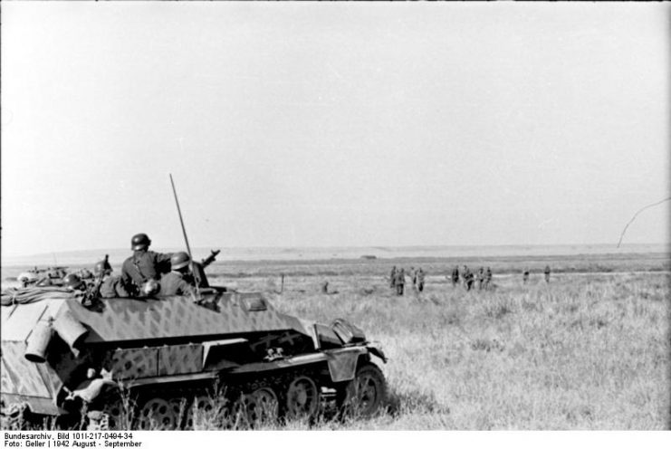 German troops and a Sd.Kfz. 251 armored half-track on the Russian steppe, August 1942. By Bundesarchiv – CC BY-SA 3.0 de
