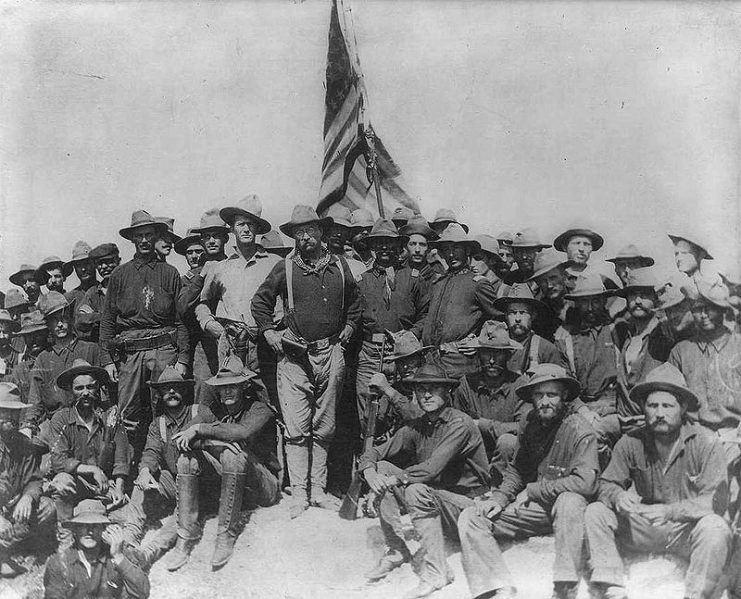Colonel Roosevelt and the Rough Riders after capturing Kettle Hill along with members of the 3rd Volunteers and the regular Army black 10th Cavalry