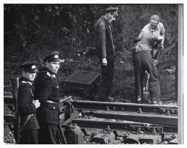 East German Construction Workers.Sept. 28, 1961. Heavily guarded East German construction workers demolish train tracks leading into West Berlin at Wornholmer Strasse.