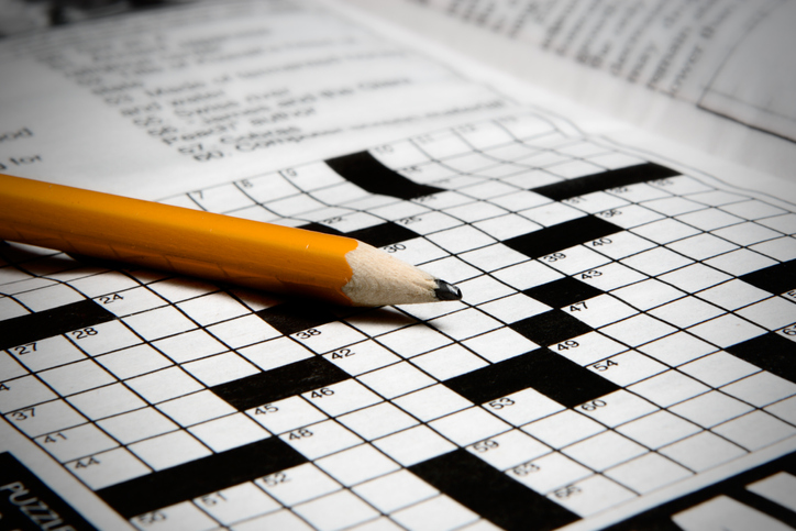 A pencil and a crossword puzzle.