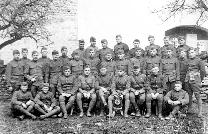Officers and men of the 135th Aero Squadron with their mascot “Rin Tin Tin” shortly after his rescue as a puppy in 1918.