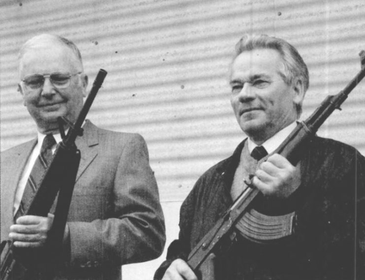 Eugene M. Stoner, left, and Mikhail T. Kalashnikov hold the rifles they designed, taken May 1990.