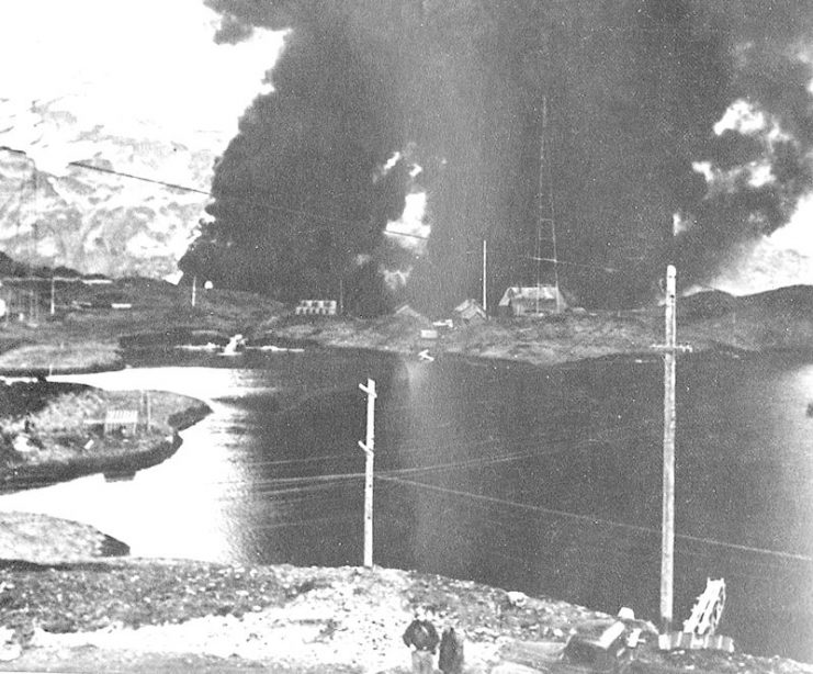 The Navy radio station at Dutch Harbor burning after the Japanese Attack, 4 June 1942