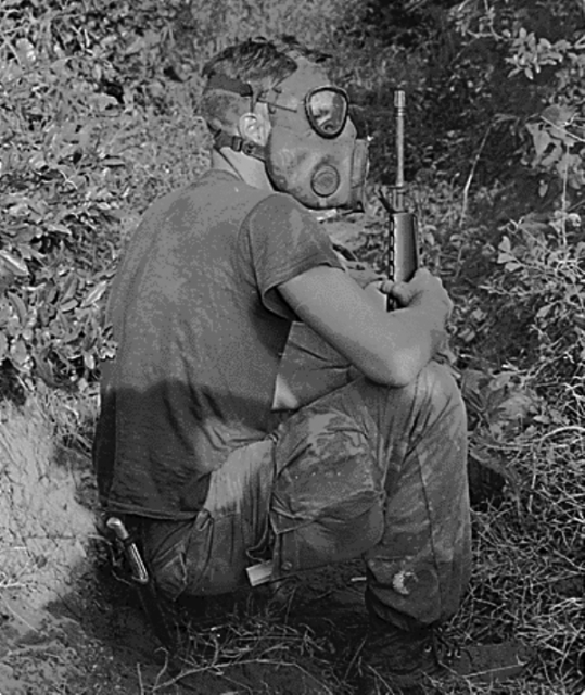 Vietnam tunnel rats.Using a gas mask during the operation.