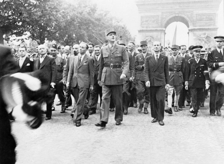 General Charles de Gaulle leads the parade celebrating the liberation of Paris the previous day. Marcel Flouret is second from the right.