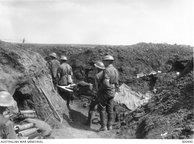 Stretcher bearers of the 8th Battalion carrying wounded back along the trenches