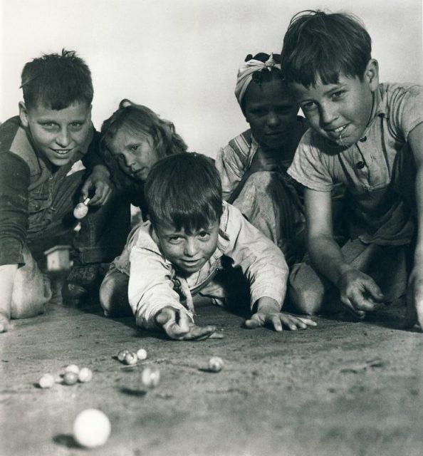 Children playing marbles. 1940. original source unknown