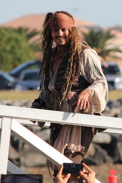 Johnny Depp in full costume returning to land in Cleveland, Queensland after a day of filming for the movie Pirates of the Caribbean: Dead Men Tell No Tales. Located at the Raby Bay Volunteer Marine Rescue on June 4, 2015.