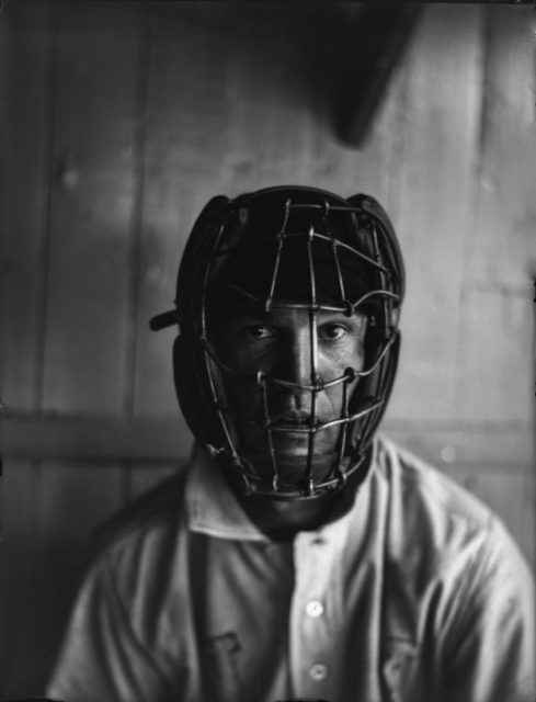 A player wearing an old-fashioned catcher’s mask.