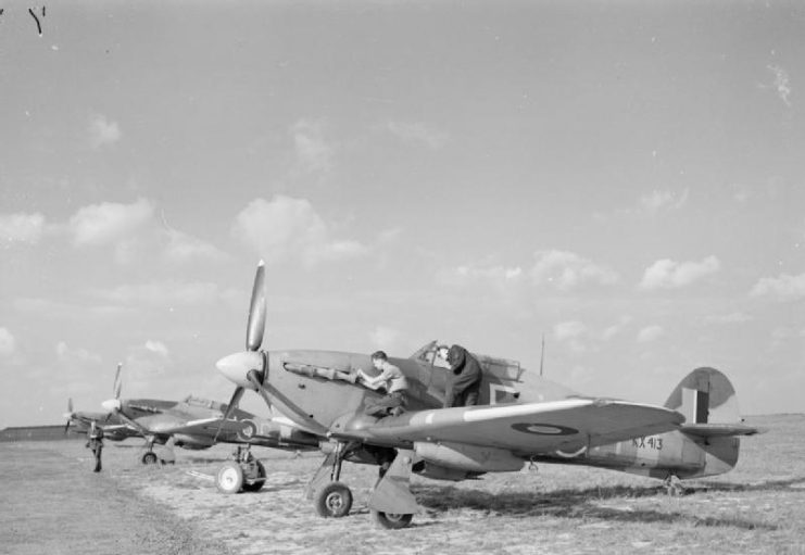 Three Hurricane Mark IVs of No. 164 Squadron undergoing servicing at RAF Middle Wallop, Hampshire.