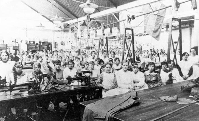 The seamstresses at Burberry’s of Basingstoke pose at their machines right at the end of the war (1918). Photo: Hampshire and Solent Museums / CC BY-SA 2.0