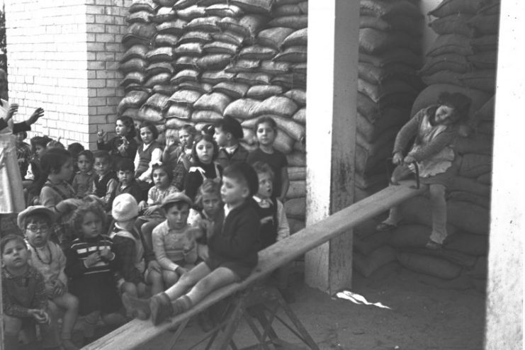 Children playing in a shelter converted to a kindergarten in Tel Aviv, during World War II, May 1940