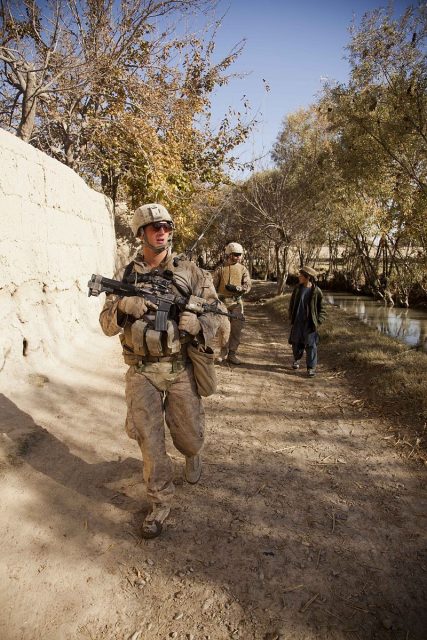 U.S. Marine Corps Cpl. David A. Mackay with India Company, 3rd Battalion, 7th Marines, Regimental Combat Team 8, conducts a security patrol in Sangin, Afghanistan.