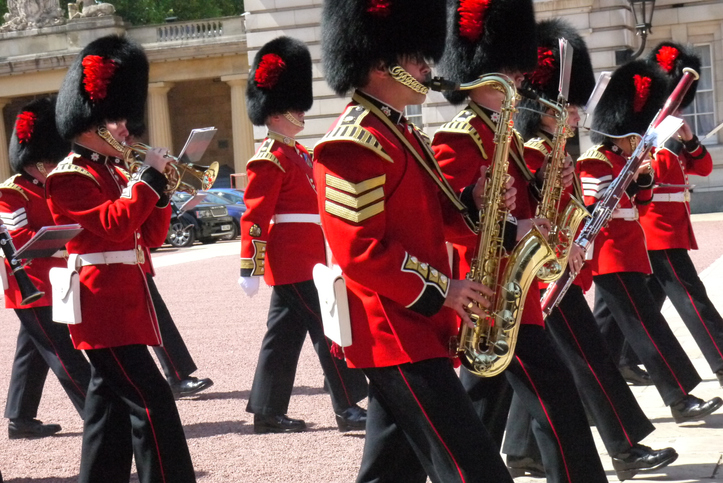 Guards perform during the changing of the Guard in front of the entrance of Buckingham Palace on June 4, 2013 in London, UK