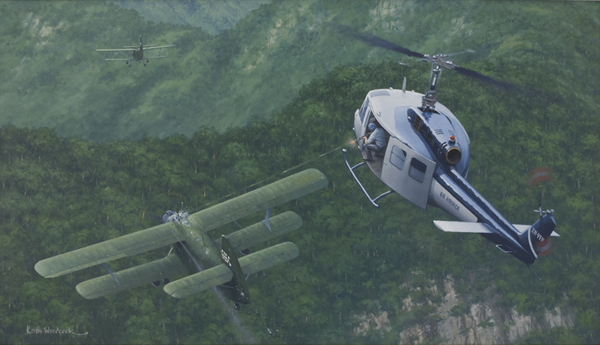 Painting of an Air America Bell 205 helicopter engaging two Vietnam People’s Air Force Antonov An-2 biplanes dropping 120 mm mortar rounds on Lima Site 85, Laos,12 January 1968