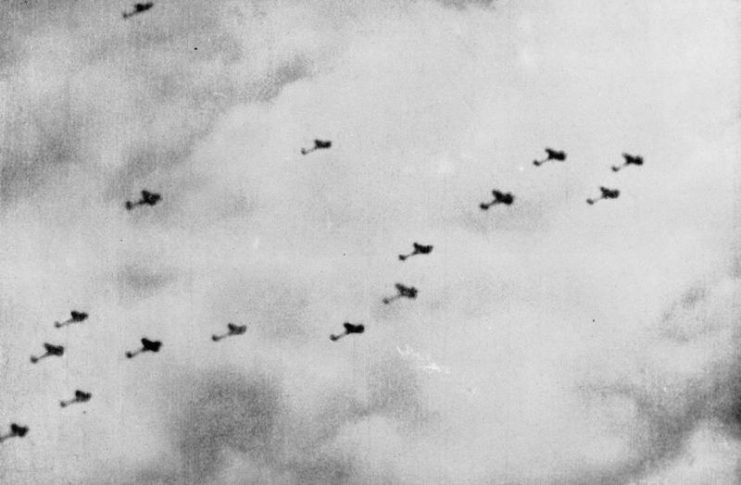 A still from camera-gun film taken from a Supermarine Spitfire Mark I of No. 609 Squadron RAF, flown by by Pilot Officer J D Bisdee, as he dives on a formation of Heinkel He IIIs of KG 55 which had just bombed the Supermarine aircraft works at Woolston, Southampton.