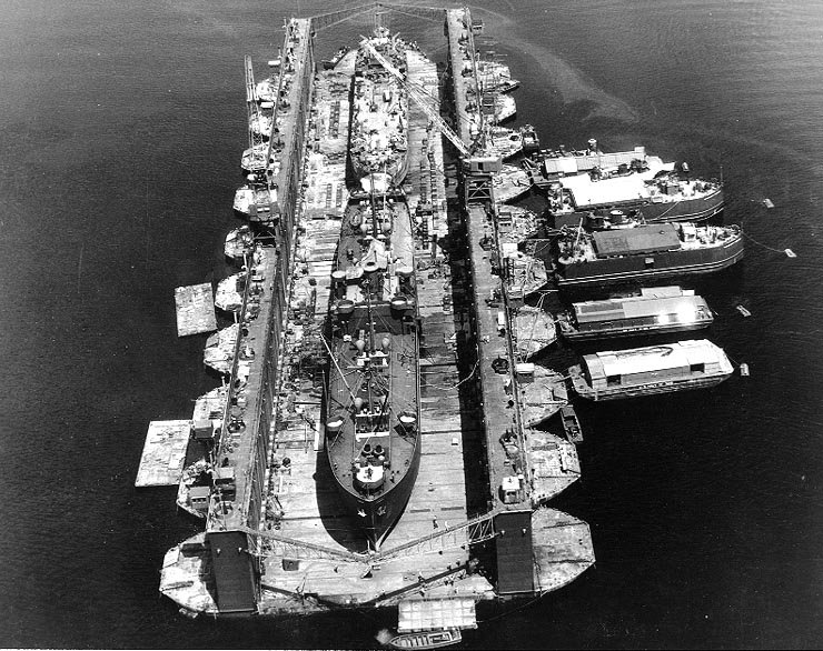 USS Artisan (ABSD-1) with USS Antelope (IX-109) and LST-120 in the dock at Espiritu Santo, New Hebrides Islands, 8 January 1945