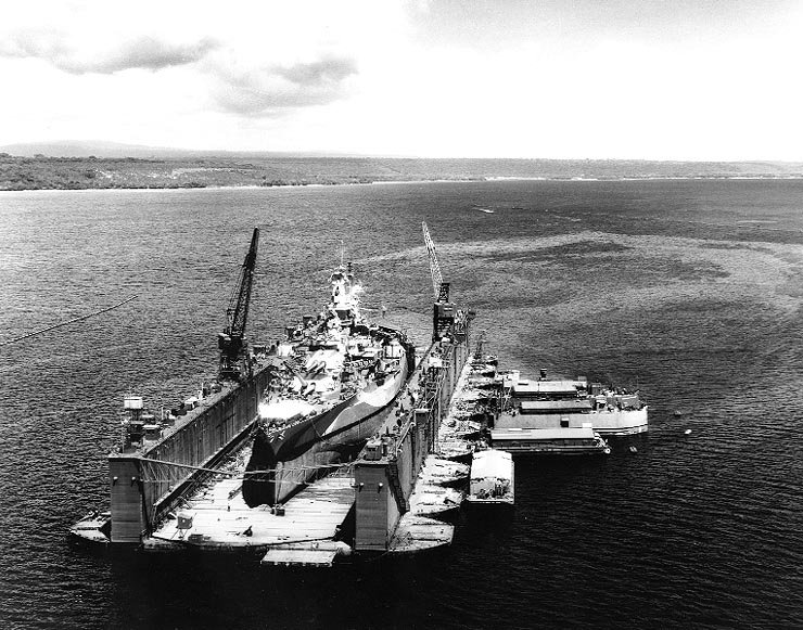AFDB-1 with West Virginia (BB-48) high and dry in the dock, off Aessi Island, Espiritu Santo, New Hebrides, 13 November 1944.
