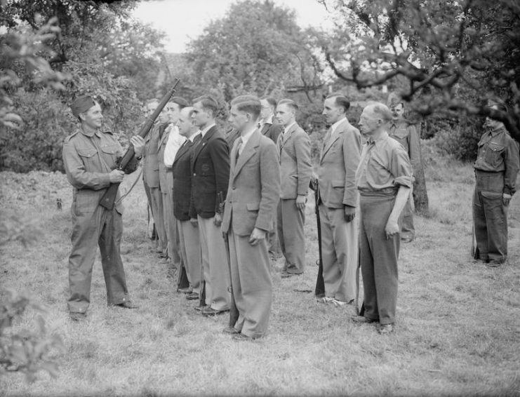 A company of Local Defence Volunteers (LDV) learning rifle drill at Buckhurst Hill, Essex, 1 July 1940.
